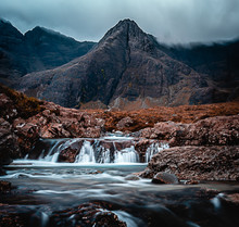 Fairy Pools Waterfall In The Isle Of Skye, Scotland Located Next To Glen Brittle In The Scottish Highlands. Natural Magical Place With Vivid Colors And Crystal Clear Blue Pools On The River.