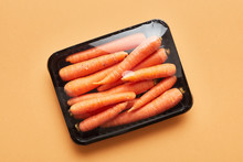 Plastic Wrapped Carrots In Container