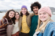 © guille Faingold/Stocksy - Positivity teens taking photo together on lake.