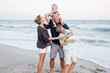 © Kelly Knox/Stocksy - family on vacation at the beach
