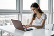 © SHOTPRIME STUDIO - young woman working on laptop at home