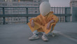 © Audrey Shtecinjo/Stocksy - Futuristic / Cosmic Kid With White Helmet/Mask Chillin'