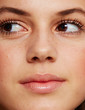 © leandro crespi/Stocksy - Cute young woman face closeup