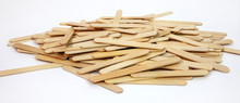 Scattered Pile Of Wooden Brown Popsicle Sticks.