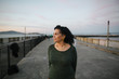 © Rob and Julia Campbell/Stocksy - Thoughtful, happy mature woman outside.