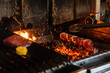 © Pietro Karras/Stocksy - Shish kebab on professional grill station