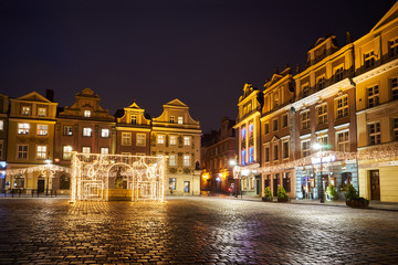 Wall Mural - The Market Square with historic tenement houses andl and christmas decorations in city of Poznan.