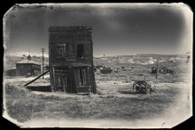 Very Old Sepia Vintage Photo With Abandoned And Crooked Western City Building Built During Gold Rush, Bodie