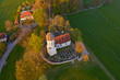 © Westend61 - Aerial view of St. Johann Baptist church and cemetery during autumn, Holzhausen, Germany