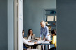 © Westend61 - Architects having a meeting, discussing a project