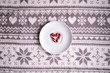 Christmas composition. Candy canes shaped in heart on winter background