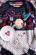 Christmas composition. Sweater, cup of hot chocolate with marshmallows and candy canes
