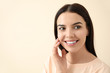 © Pixel-Shot - Beautiful young woman with healthy teeth on light background