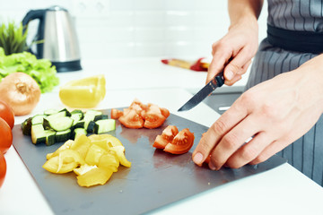 woman cutting vegetables in the kitchen