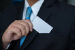 © Toefotostock - the Man showing a business cards in suit