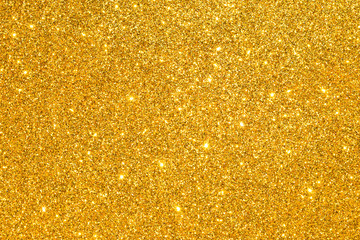 sparkles of golden glitter texture background