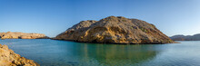 Clear Turquoise Water, Barren Hills And Clear Sky. Oman Virgin Seascape For You.