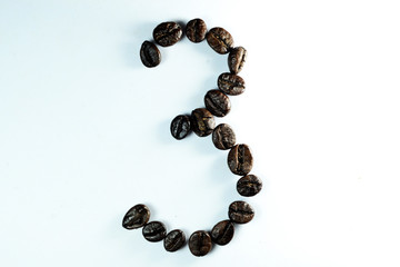 Coffee Been, the number three is formed with coffee beans in white background