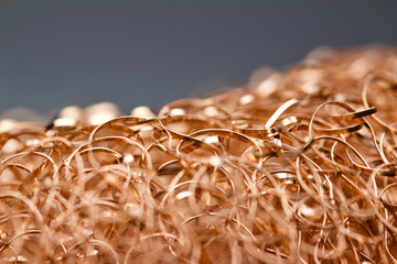 Macro abstract art background of shiny copper wire scrubbing mesh texture