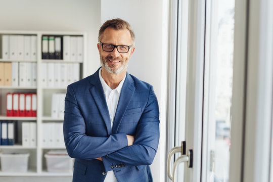 Confident stylish businessman with friendly smile