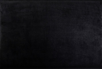 black color velvet texture. dark background. top view.