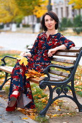 Wall Mural - Beautiful elegant woman posing in a city street, autumn season