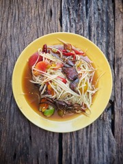 Poster - Papaya salad Thai food on wood background