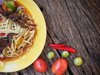 Poster - Papaya salad Thai food on wood background