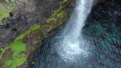 Wall Mural - Mulafossur waterfall in Gasadalur village in Faroe Islands, North Atlantic Ocean. Nordic Natural Landscape. Aerial view.