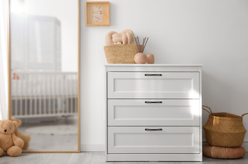 Poster - Beautiful nursery interior with white chest of drawers