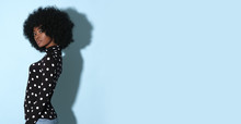 Afro-american Model In Original Black Golf With White Dots Isolated On Blue Background.