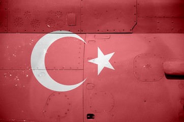 turkey flag depicted on side part of military armored helicopter closeup. army forces aircraft conce