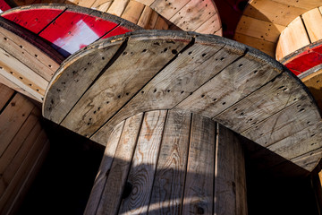 Wall Mural - Large wooden cable reels, stored in a factory of electric cables.