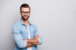 © deagreez - Photo of business macho guy young corporate meeting boss hands crossed self-confident person smiling partners wear specs casual denim outfit isolated grey color background