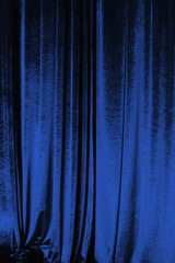 Wall Mural - Blue curtain of luxurious velvet on the theater stage. Copy space. The concept of music and theatrical art.