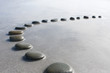 concept shallow depth of field black  stepping stones pebbles in shallow water way to success