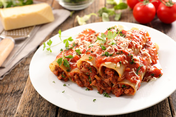 Wall Mural - cannelloni with minced beef and tomato sauce