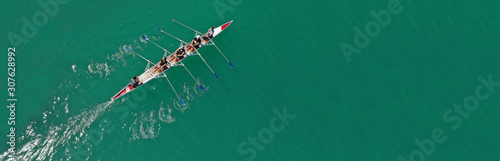 Fotomural Aerial drone top panoramic view of sport canoe rowing synchronous athletes compe