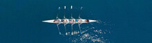 Aerial Drone Top Panoramic View With Copy Space Of Sport Canoe Rowing Synchronous Athletes Competing In Tropical Exotic Lake