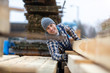 © pikselstock - Young male worker in timber warehouse