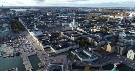 Wall Mural - Aerial drone view of Helsinki capital city of Finland. Kauppatori, president castle and church during winter evening.