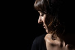 © Alessandro Grandini - profile portrait of a young girl on a black background