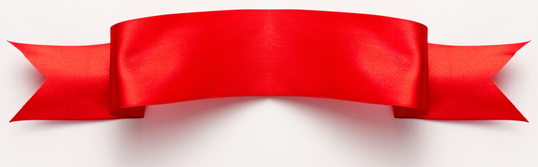 Wall Mural - panoramic shot of red and satin ribbon on white
