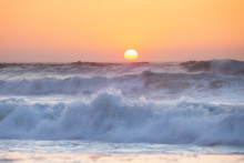 Sunset Over The Ocean. Panorama Of Ocean Waves And Setting Sun. Florida, USA