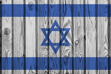 Israel flag depicted in bright paint colors on old wooden wall. Textured banner on rough background