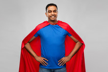 Super Power And People Concept - Happy Smiling Indian Man In Red Superhero Cape With Arms On Hips Over Grey Background