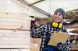 © pikselstock - Young male worker in timber warehouse