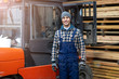 © pikselstock - Young male worker driving forklift in lumber yard