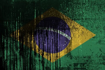 Wall Mural - Brazil flag depicted in paint colors on old and dirty oil barrel wall closeup. Textured banner on rough background