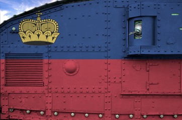 Liechtenstein flag depicted on side part of military armored tank closeup. Army forces conceptual background